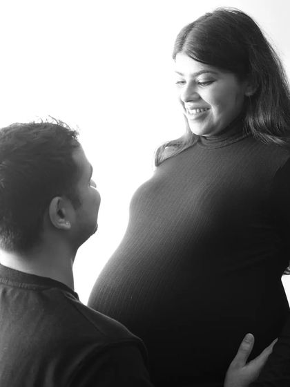 The look of love. This black and white close-up captures the happy, intimate gaze between a husband and his expecting wife. So pure and beautiful.