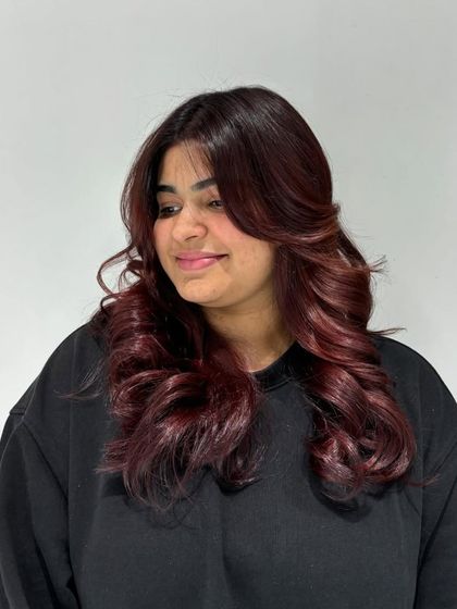 An amazing auburn hair color transformation. These photos show the rich, warm red tones that completely revitalized our client's look.