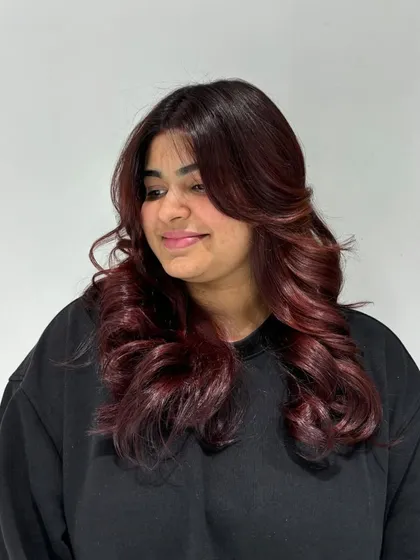A stunning auburn hair color transformation. This shade is a beautiful blend of red and brown for a warm, fiery look.