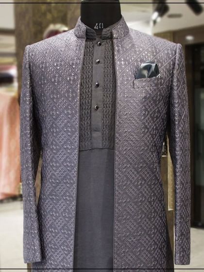 A close-up of the layered grey Indo-Western jacket, showing the texture of the fabric and the neatness of the tailoring.