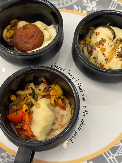 Three small bowls of our delicious appetizers, showcasing the variety and elegant presentation of our starters.