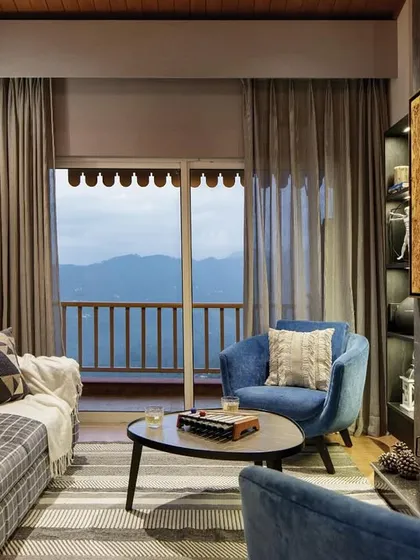 The living room is the soul of the home. Here in the Valley of Dreams, we anchored the space with a hand-built fireplace and our signature Ava chairs. This setting shows our belief in creating comfortable, inviting spaces where the design warms you even before the fire is lit.
