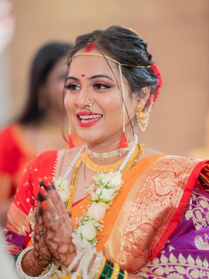 A candid shot capturing the bride's joy and elegance during her wedding ceremony.