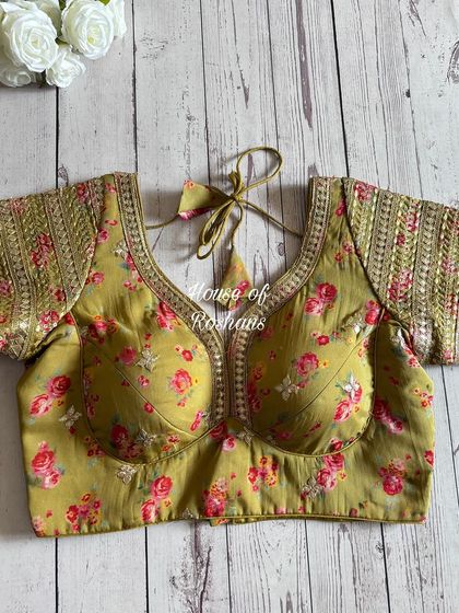 A beautiful floral printed blouse with gota work on the sleeves. This is a perfect pick for a summer wedding or festive occasion.