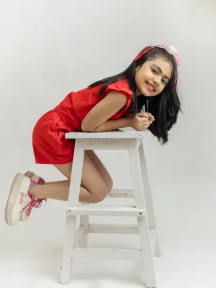 A playful and dynamic pose that shows off her fun-loving personality.