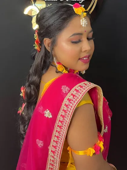 Another angle of the Haldi look, focusing on the flawless skin and rosy cheeks.
