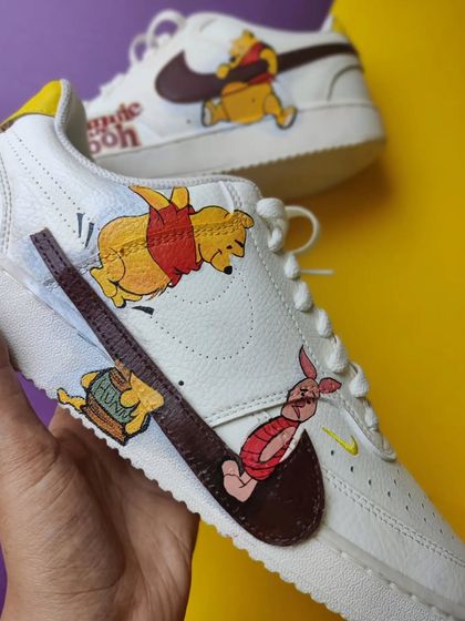 A close up of the Winnie the Pooh custom, showing the detail on Pooh, Piglet, and the "Hunny" pot.