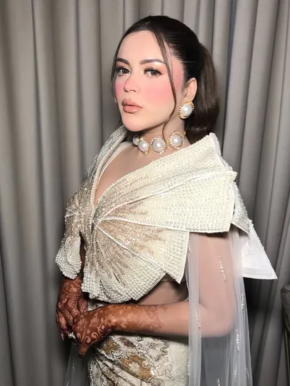 Another angle of the client, her confidence shining as brightly as her pearls.