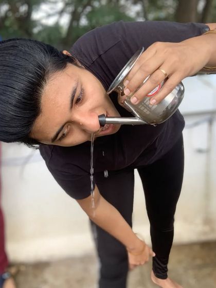 Another student performing Jala Neti, demonstrating a key part of our traditional Hatha yoga and teacher training curriculum.