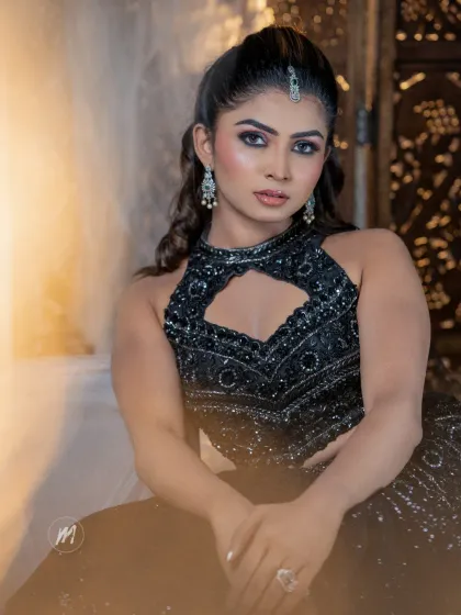 This shot captures the moodiness and drama of the look, perfect for a fashion-forward client.