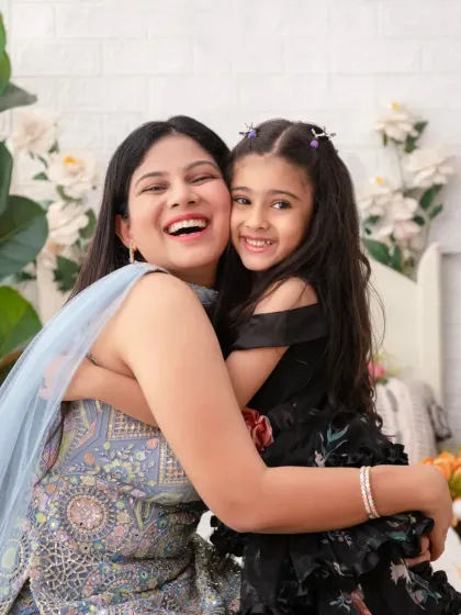 A mother and daughter share a heartfelt hug. This image is a perfect example of the genuine, happy moments we love to capture.