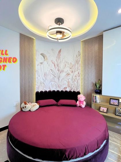 A unique and playful bedroom with a custom-designed circular cot, perfect for a child's or teenager's room.
