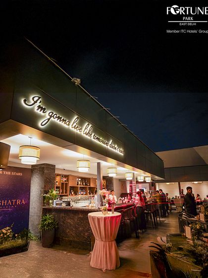 The neon sign at Nakshatra captures our philosophy: "I'm gonna live like tomorrow doesn't exist." It's a reminder to savor every moment.