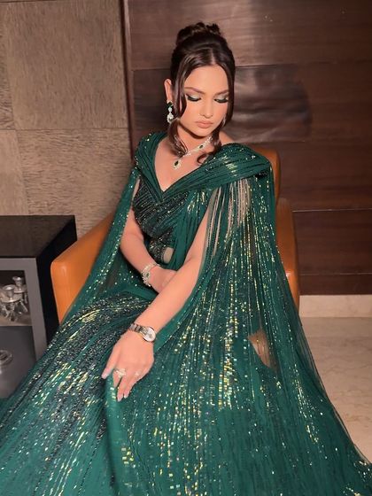 A full-length shot that captures the glamour and drama of this entire ensemble. This is a perfect look for a high-fashion wedding event.