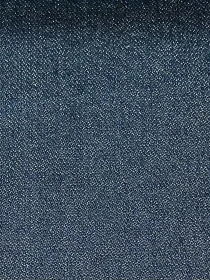 A dark blue denim with a slightly textured weave. This fabric has a substantial weight, making it perfect for durable, everyday jeans.