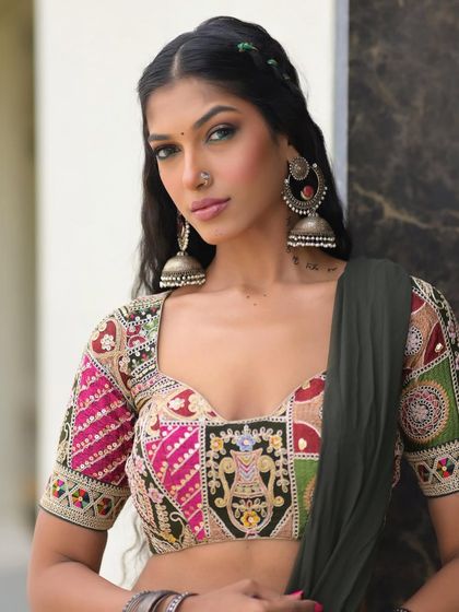 The final look is a perfect blend of tradition and trend. The green eyeliner adds a modern twist to the classic festive attire.