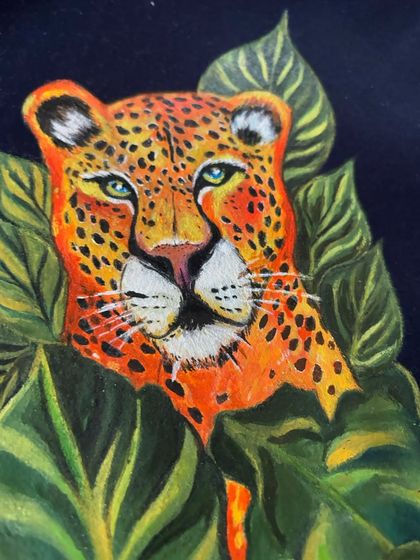 An extreme close-up of the leopard's face. Here you can appreciate the fine details in the eyes, the texture of the nose, and the individual spots that were each painted with care.