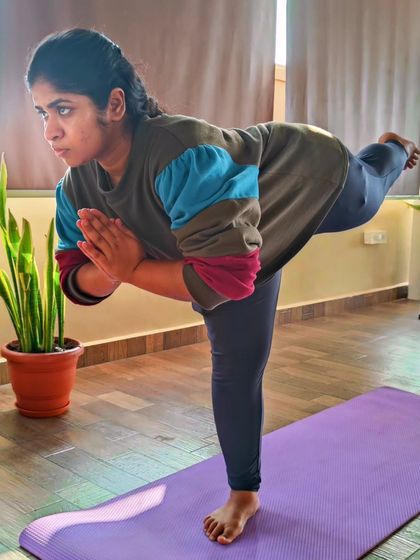 This student shows great focus and stability in Virabhadrasana III (Warrior Pose III). This balancing pose strengthens the entire standing leg and core, and dramatically improves concentration.