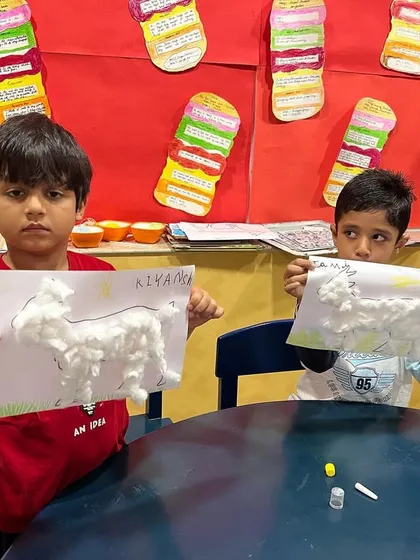 Making fluffy sheep with cotton balls during our spring camp. This is a great sensory craft activity that the kids always enjoy.