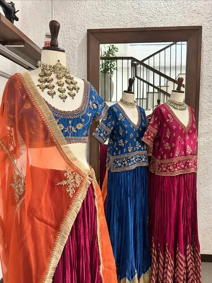 A wider view of my lehenga collection on display. The rich jewel tones of blue and magenta create a vibrant and inviting sight for any bride-to-be or wedding guest.