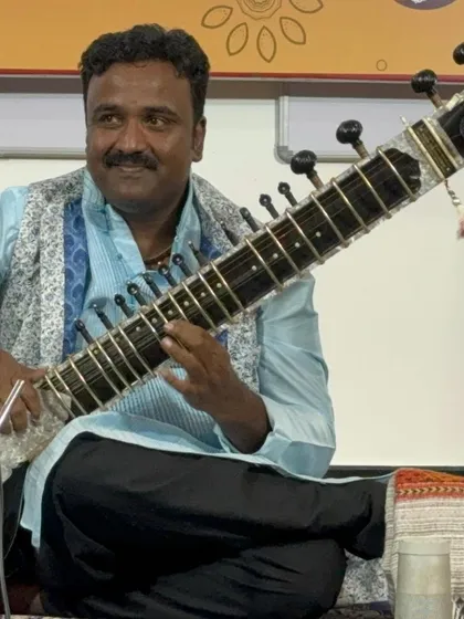 Welcome. I am Vijay Gonahalu, and I look forward to starting this musical journey with you. Here I am during a performance, ready to share the art of the sitar.
