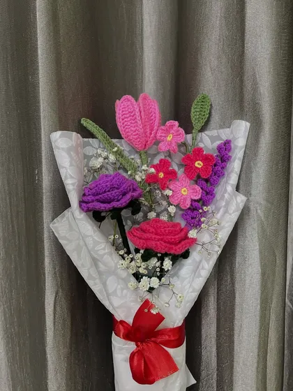 A full view of one of my custom crochet bouquets, beautifully wrapped and ready for gifting. This arrangement includes handmade tulips, roses, and other small blossoms, making it a perfect, lasting gift for an anniversary or special occasion.