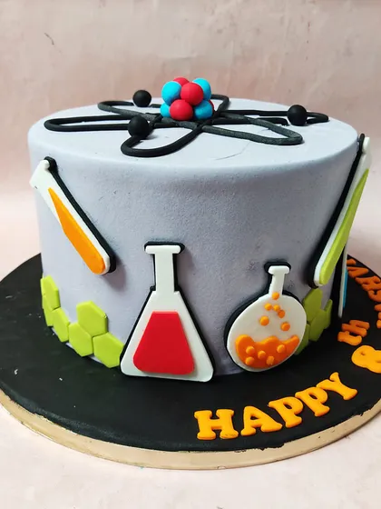 Another angle of the science-themed cake, perfect for a budding scientist's birthday.