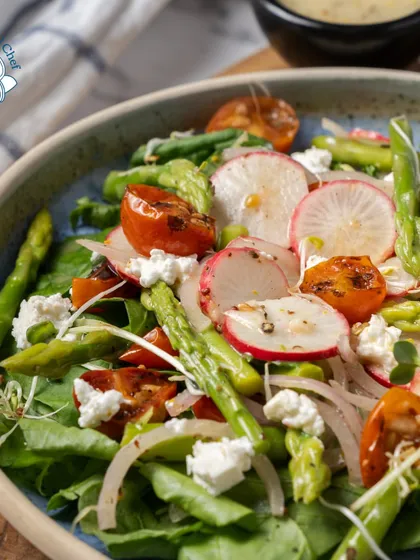 This complex and delicious salad features a mix of cherry tomatoes, cracked wheat, tofu, and peas in a paprika pesto, with asparagus, radish, and mozzarella. It's a full meal in itself, showcasing my commitment to creative vegetarian cuisine.