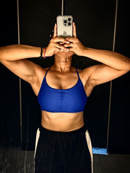 A more artistic shot showing the results of my upper body workouts. Building strong arms and shoulders is a key part of my personal fitness routine.