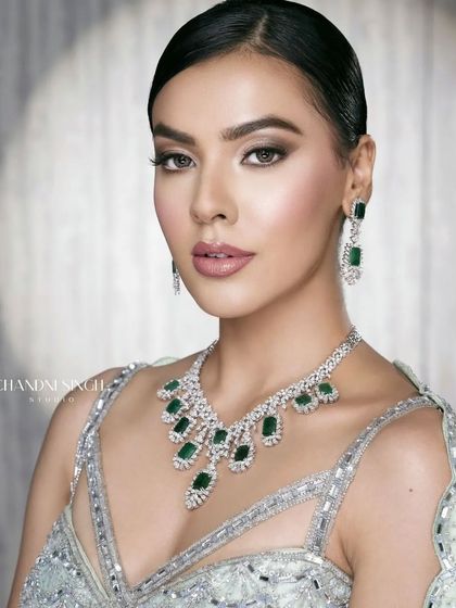 A stunning portrait from my online masterclass, featuring a soft glam look with an emerald necklace. The makeup is designed to be luminous and elegant, perfect for a cocktail or reception.