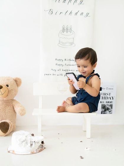 A candid moment after the cake smash is over. Even the post-cake moments are full of cute expressions and photo opportunities.