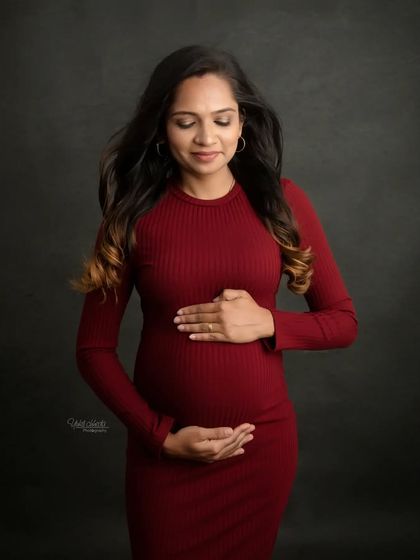 A simple and elegant solo portrait. The rich color of the dress and your serene expression make this a beautiful and timeless image.