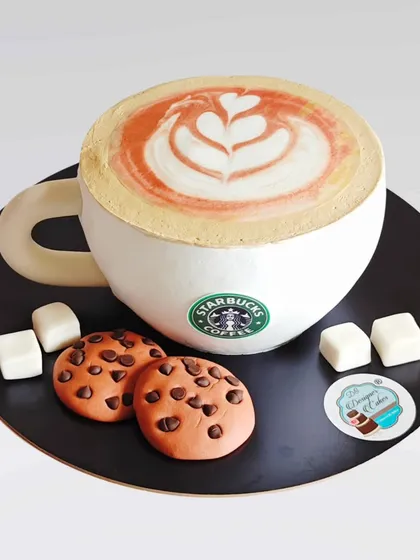 For the coffee aficionado, I designed this Starbucks coffee cup cake complete with latte art and chocolate chip cookies. This 3D cake is made with whipped cream and is a perfect tribute to a daily ritual.