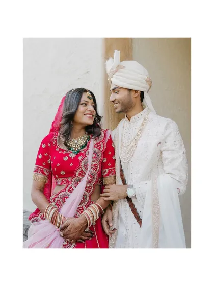 A classic, elegant portrait of Sanket and Sakshi. Their gentle smiles and the soft, natural light create a timeless image that perfectly captures the romance of their wedding day.