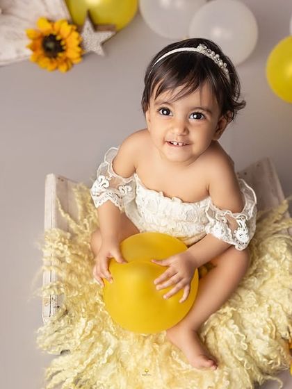 A field of sunshine for this little ray of light. Her sunflower-themed first birthday shoot was bright, cheerful, and full of the sweetest smiles as she sat among the blooms.