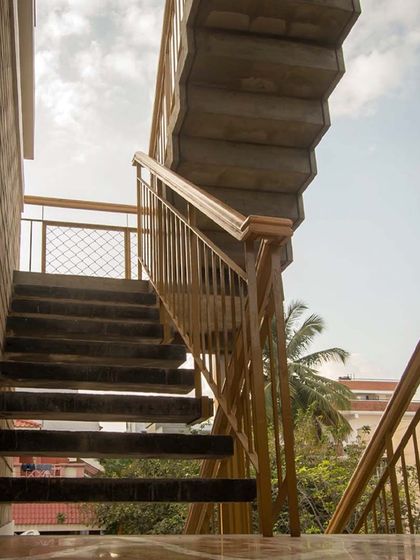 The consistent use of materials and color in this staircase creates a harmonious visual experience.