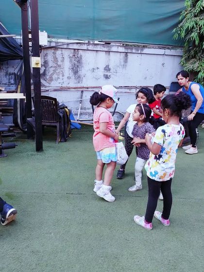 Huddle up, team! These little moments of discussion are where leadership and communication skills are born. The kids learn to listen to each other's ideas and work together towards a common goal.