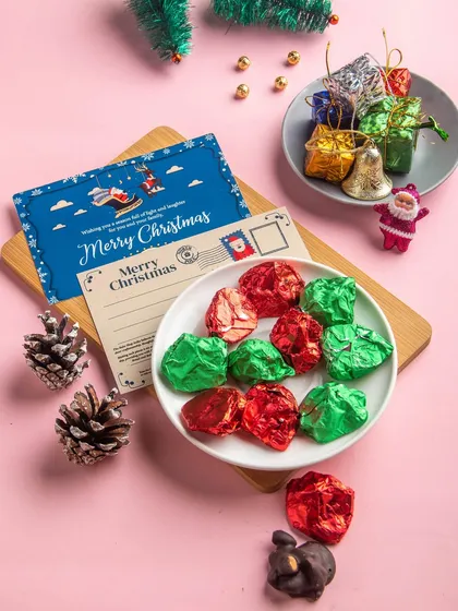 Our assorted chocolate rocks, a crunchy mix of cashews and almonds coated in milk and dark chocolate, wrapped in festive foil.