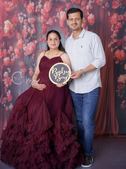 A proud "Baby Boy" announcement from the happy couple. This portrait is a perfect blend of celebration and anticipation.