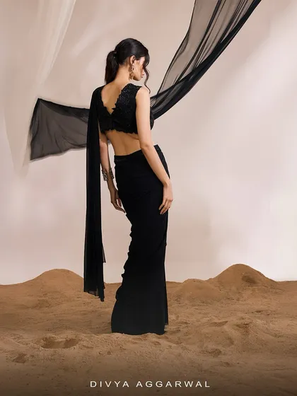 The back view of the Eve Saree Set, showcasing the deep V-back of the blouse and the dramatic sweep of the attached drape.