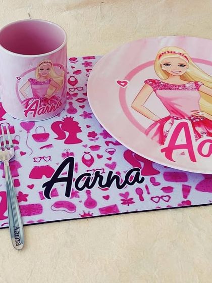 For the Barbie girl, this personalised dinner set is a dream come true. It features a plate, mug, and placemat, all in her favorite theme.