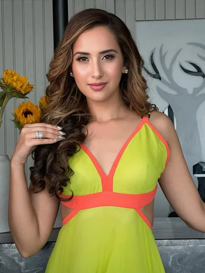 Another beautiful portrait. The soft, glowing makeup enhances her features and gives her a radiant and confident look.