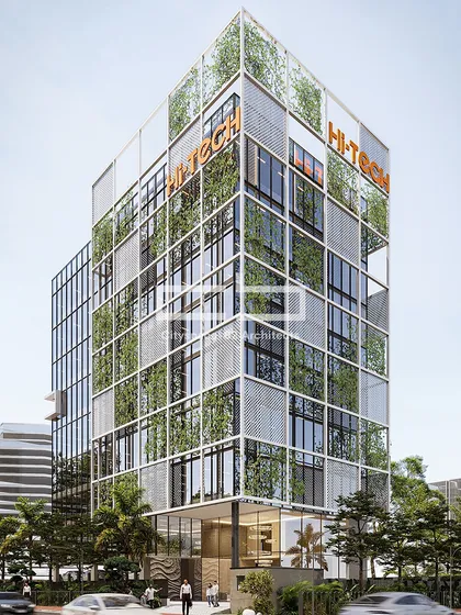 This contemporary office building makes a bold presence in the skyline with its striking glass facade and vertical greenery. The structure stands as a testament to innovative urban architecture and sustainable practices.