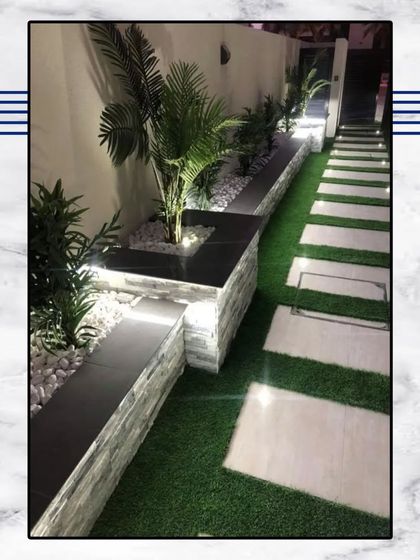 Experience a life that's worth every moment. This beautifully lit garden path is an inspiration for creating a serene and magical outdoor space. Your dream home awaits.