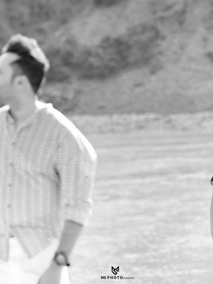 A black and white shot that creates a sense of story, with him in the foreground and her in the background. It’s an artistic and thought-provoking image.