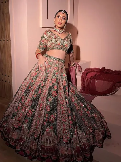 A full-length shot of the floral lehenga. The combination of the printed skirt and the embroidered blouse is both traditional and modern.