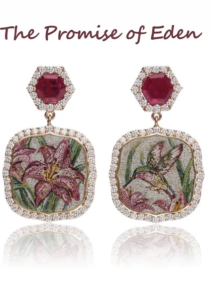 The "Promise of Eden" earrings, handcrafted in 18k yellow gold. This pair features 2.23 carats of Mozambican rubies from Gemfields, complementing the micromosaic bird and flower motifs.