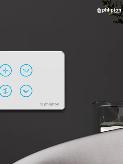 A close-up view of a four-icon panel controlling two fans. The minimalist design ensures it blends perfectly into any modern interior while offering precise control.