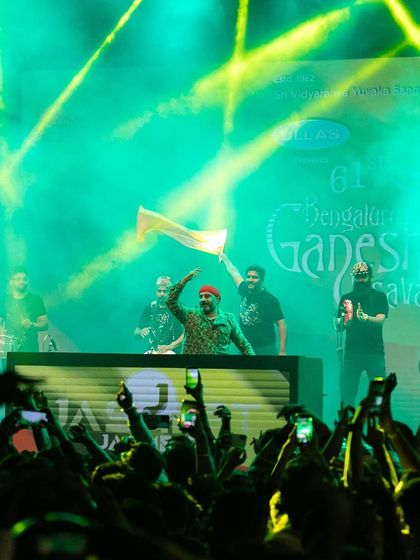 A shot from the Bengaluru Ganesh Utsava, with the crowd's hands in the air as we blend DJ beats with live percussion.