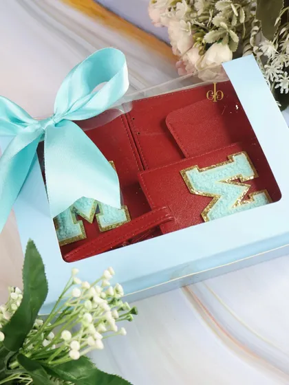 Our red travel combo set, elegantly packed in a gift box with a light blue ribbon, making it a ready-to-give present.
